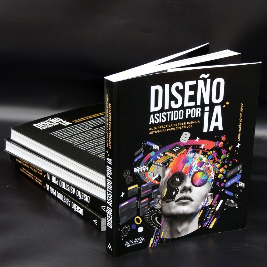 Ejemplares del libro Diseño Asistido por IA, de Anna María López López, publicado por Anaya Multimedia. Portada negra con una ilustración colorida de un rostro con gafas rodeado de elementos de interfaz.